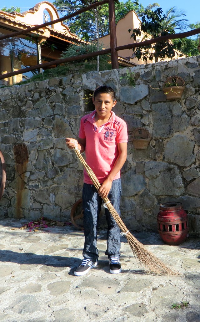 Ezekiel, sweeping with homemade broom at Finca Don Gabriel, Pluma Hidalgo, Oaxaca.