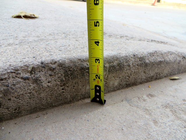 Three inches, the standard height of the tope. 