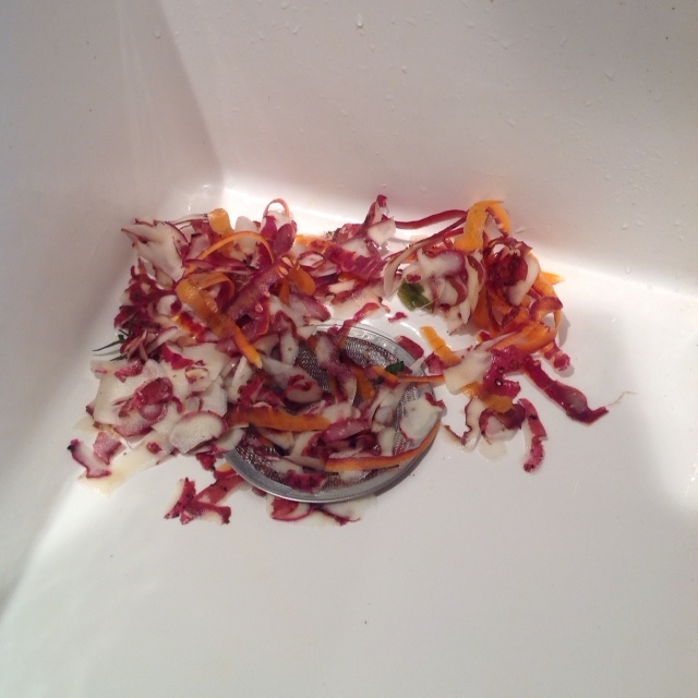 Carrot and potato peelings, painting in the sink. 